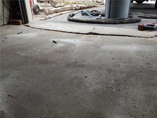 Garage Floor Cracked and Separated in Aurora, Ontario