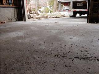 Garage Floor Cracked and Separated in Aurora, Ontario
