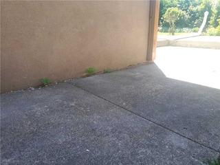 Sinking Walkway Next to Garage Foundation in Toronto, Ontario