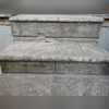 As the steps were sinking more water was able to seep behind the concrete, causing even more of a tripping hazard