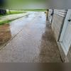 You can see the driveway settling away from the home leaving a gap in the foundation.