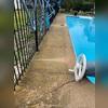 Notice on this side there's a major crack that runs along the edge of the pool out to the grass. This can invite water through the crack and cause further damage.