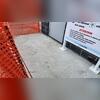 The concrete pad is level and the injection holes are covered with fresh concrete.