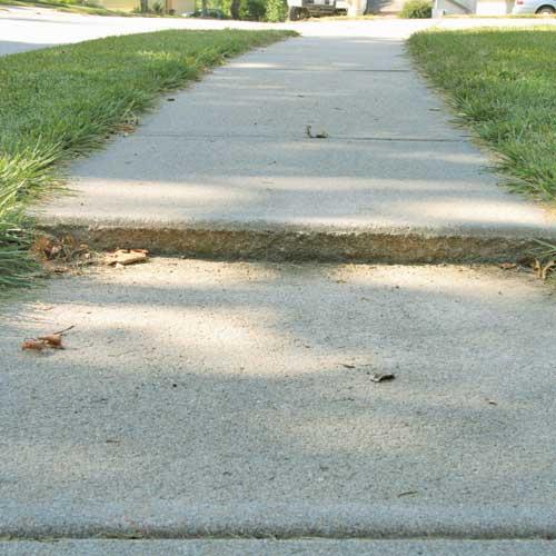 Sidewalk leveling — before