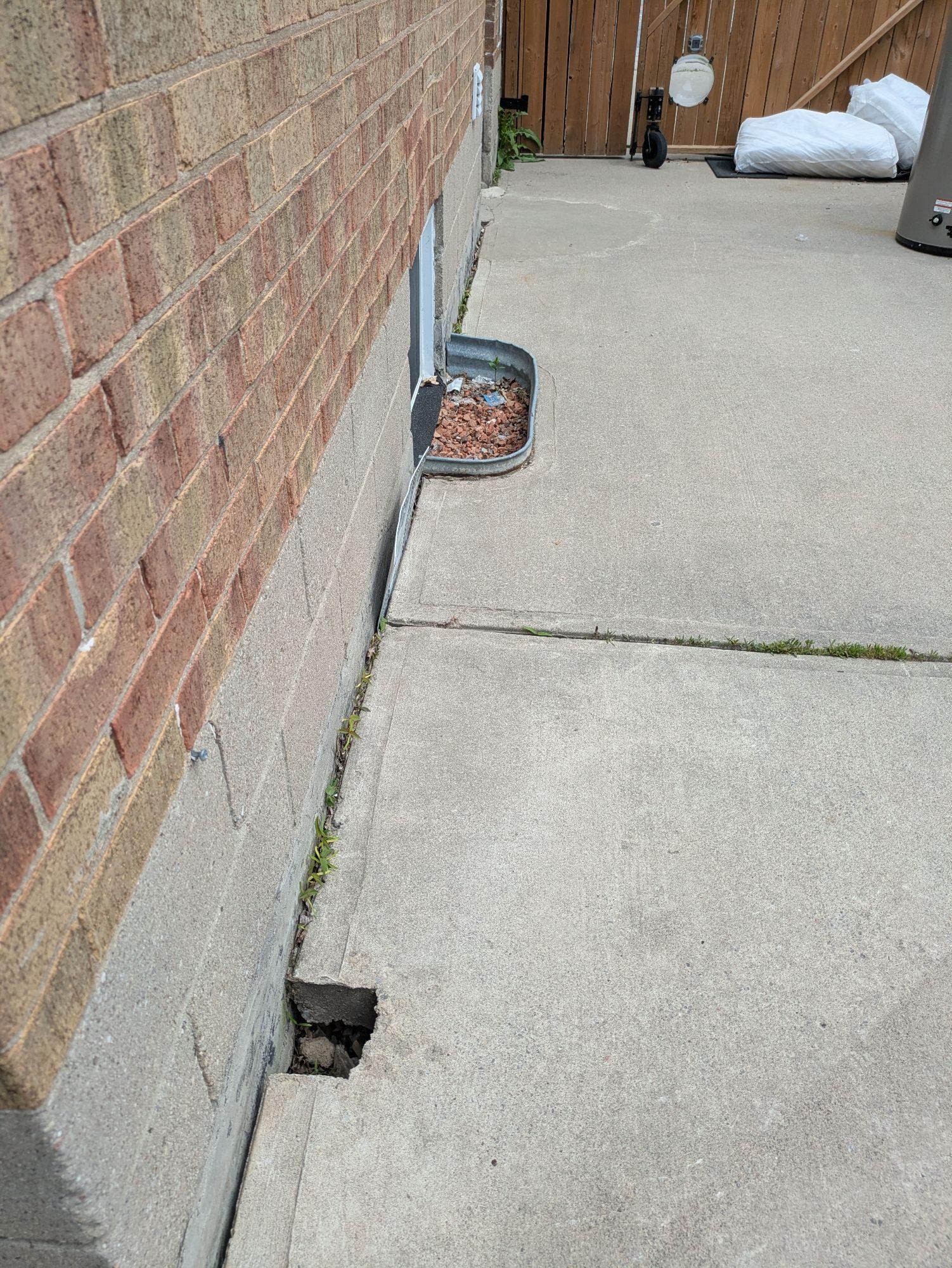 Sinking Concrete Patio Repair in Toronto - Before Photo