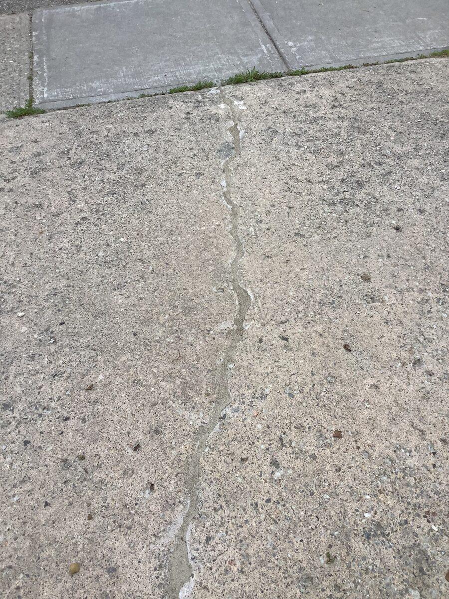 Completed concrete driveway repair in Toronto with the crack and joint professionally sealed