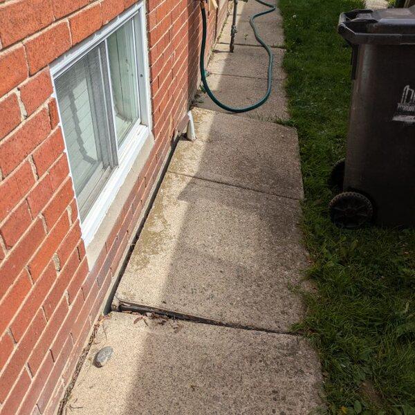 Sunken North York concrete walkway before lifting and drainage repair
